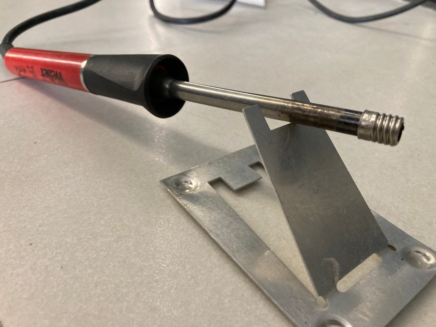 The base is put on the soldering iron